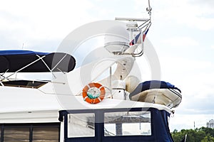 Close details of radar navigation system and communication tower on a fancy motor yacht