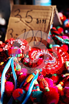 Close focus on colorful souvenir on shelf with blurry price tag