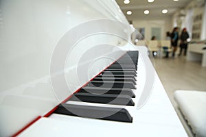 Close frontal . The piano was set up in the music room to allow the pianist to rehearse before the classical piano performance in