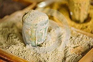 Close Grated Nutmeg Fragrant Seasoning Condiment In Glass In Tra