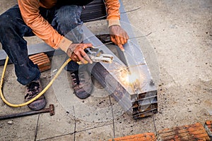 Close hand man arc welding or stick welding