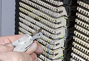 Close of hands punching down circuit panel 2