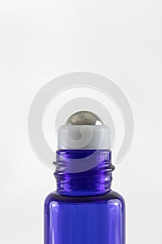 Close-In Macro Shot of An Essential Oil Roller Bottle - Vertical
