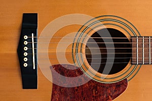 Close macro view of the six frets  on an acoustic guitar photo