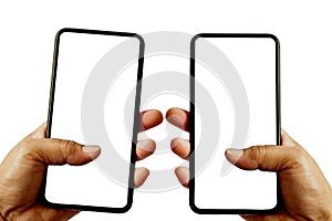 Take a close-up shot of two black smartphones isolated on which the 2 hands woman turns off the device photo