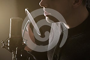 A close photo of the lips of the singing guy at the microphone. Horizontal frame