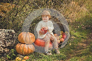 Close portrait baby girl with blond red hair wearing ivory colour white sweater enjoy life time city village with basket ped crib