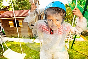 Close portrait of a child in bubble wrap on swing