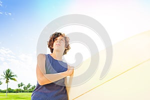 Close portrait of confident little surfer