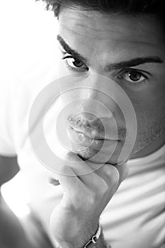 Close portrait handsone young man thinking