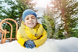 Close portrait of little boy in snow park