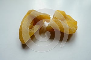 Close shot of 2 fleshy yellow dried passion fruit slices