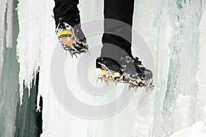 Close shot of a climber`s feet on ice