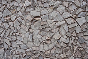 Close shot of gray gravel pebble dash