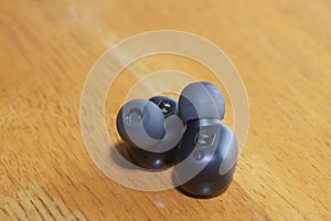 Close shot image of black wireless earpod.