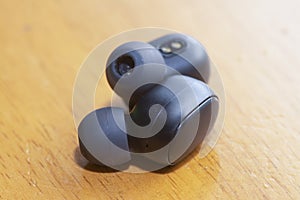 Close shot image of black wireless earpod.