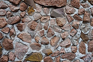 Close shot of multicolored gravel pebble dash on the wall