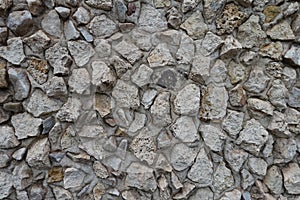 Close shot of wall with light gray gravel pebble dash