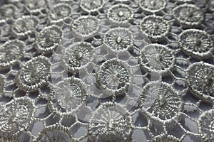 Close shot of white lacy fabric