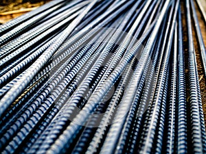 Stack of steel rebar for reinforcement concrete at construction site photo