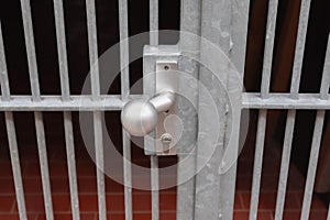 Close uo of a lock at a close metal gate