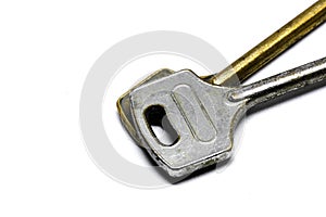 Close-up of 2 keys. One gold key and one silver key