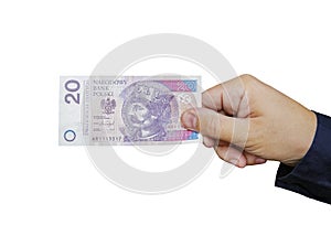 Close up on a 20 zloty banknote in a man's hand. Isolated object on white background