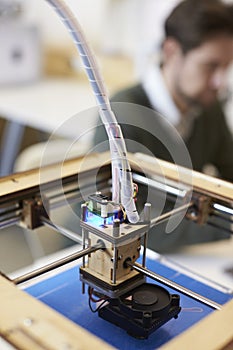 Close Up Of 3D Printer Operating In Design Studio