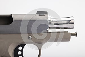 Close up of .45 semi automatic pistol handgun on white background , Gun slide opened