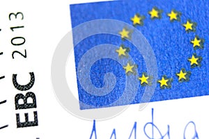 Close-up of a 5 euro banknote fragment with the flag of the European Union. Macro photography.