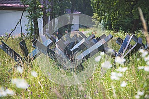 Close up of abandoned anti tank barrier in a savaged flower field