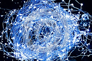 Close-up of abstract Christmas glitter blue lights ball on xmas