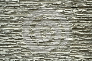 Close up abstract pattern of sandstone brick wall background in vintage tone style and vertical frame