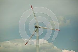 Close up abstract view of a giant wind turbine with blue sky