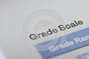 Close-Up of Academic Document Showing Grade Scale and Evaluation Criteria