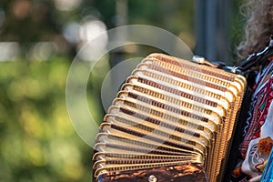 Close up of accordion and accordion player playing at Klezmer concert of Jewish music in Regent`s Park in London