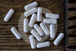 Close-up of acetyl l-carnitine pills. dietary concept. dietary supplement topview photo
