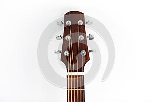 close up of acoustic guitar head with pegs