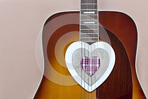 Close up of Acoustic guitar with heart