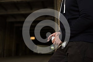 Close up of addict or drug dealer hands with money