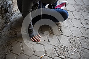 Close up of addict woman and drug syringes