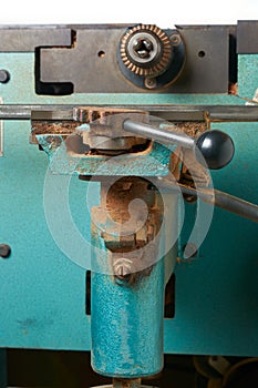 close-up of adjustment lever of planing machine