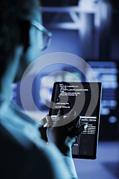 Data center manager codes on tablet