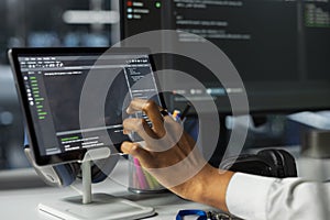 Close up of admin using tablet in server farm