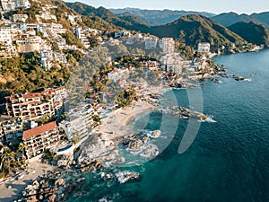 Close-up aerial view of Conchas Chinas Beach and it nearby hotels in Puerto Vallarta Mexico photo