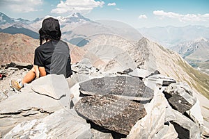 Close up aerial view Inspired caucasian hiker woman stand on top mountain enjoy panorama outdoors determined to reach personal