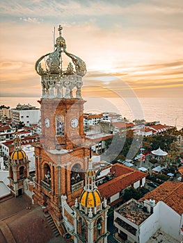 Close up aerial view of our Lady of Guadalupe church in Puerto Vallarta, Mexico with sun setting