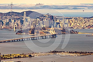 Close up aerial view of the San Francisco Bay bridge and the financial district of San Francisco