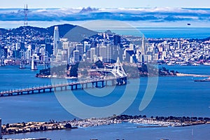 Close up aerial view of the San Francisco Bay bridge and the financial district of San Francisco