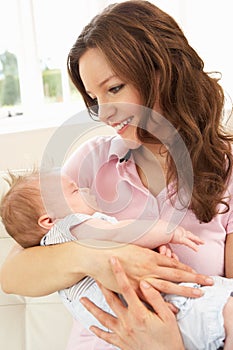 Close Up Of Affectionate Mother Cuddling Baby Boy